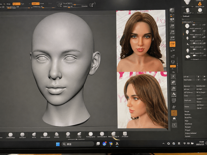 Computer screen displaying 3D digital facial sculpting for custom silicone doll using reference photos.